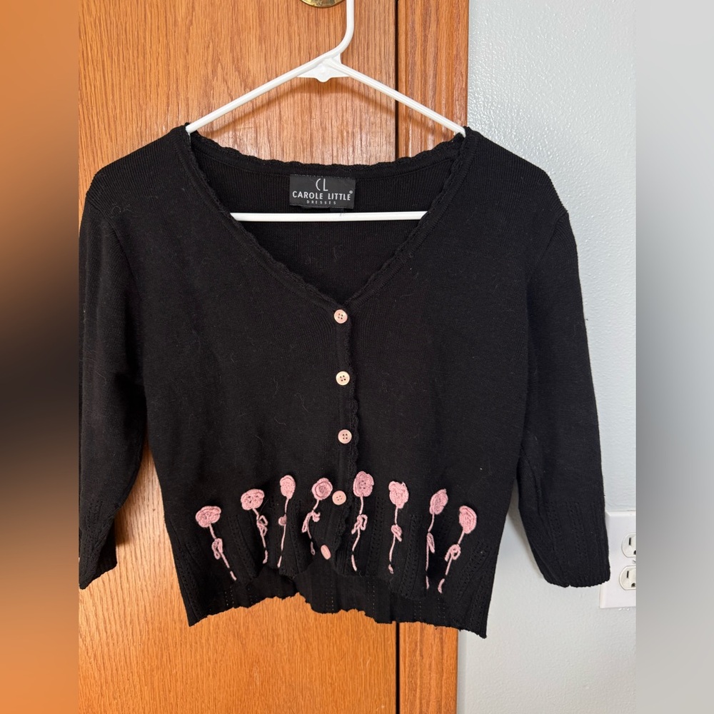 Carole Little short, black knit cardigan with pink flowers stitched along bottom